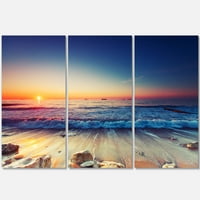 Designart 'Beautiful Sunrise over Blue Sea' tengerpart vászon Art Print